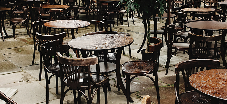 stylish wooden chairs and tables empty at rainy da 2021 08 29 13 38 48 utc